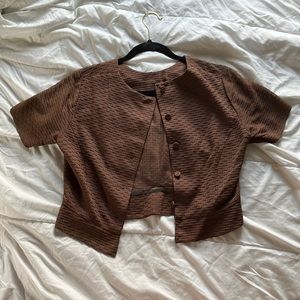 A vintage, perfect condition cropped button up shirt. Fits small to medium